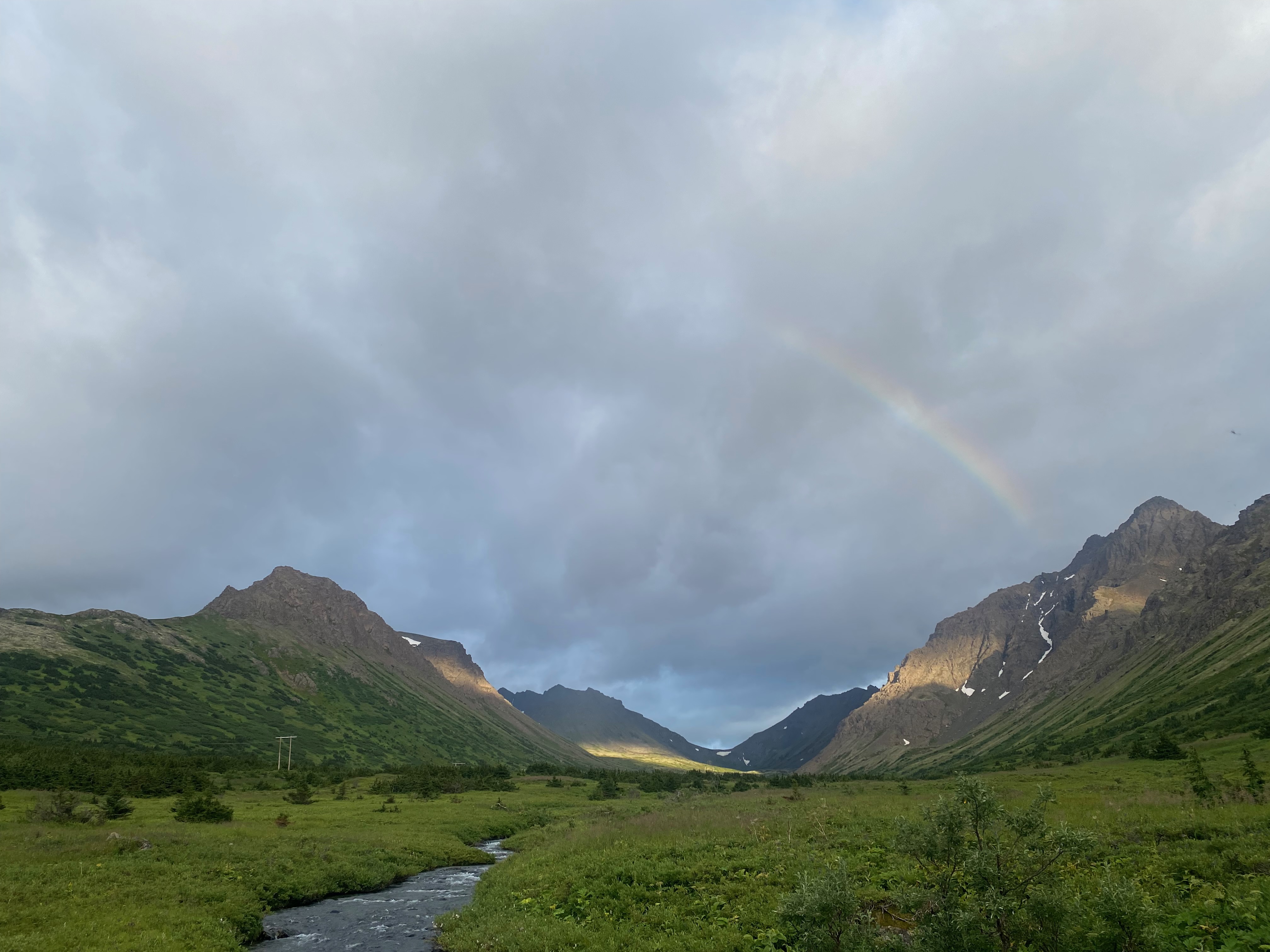 Rainbow over mountain valley